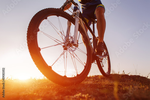 low angle view of cyclist riding with mountain bike on trail at