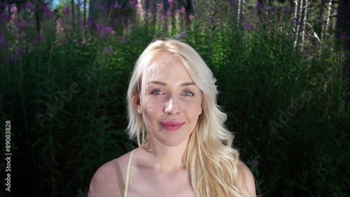 Fotografie Beautiful blonde girl smiling to the camera
