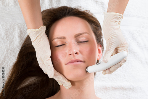 Woman Receiving Microdermabrasion Therapy