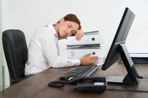 Young Businesswoman Looking At Folders