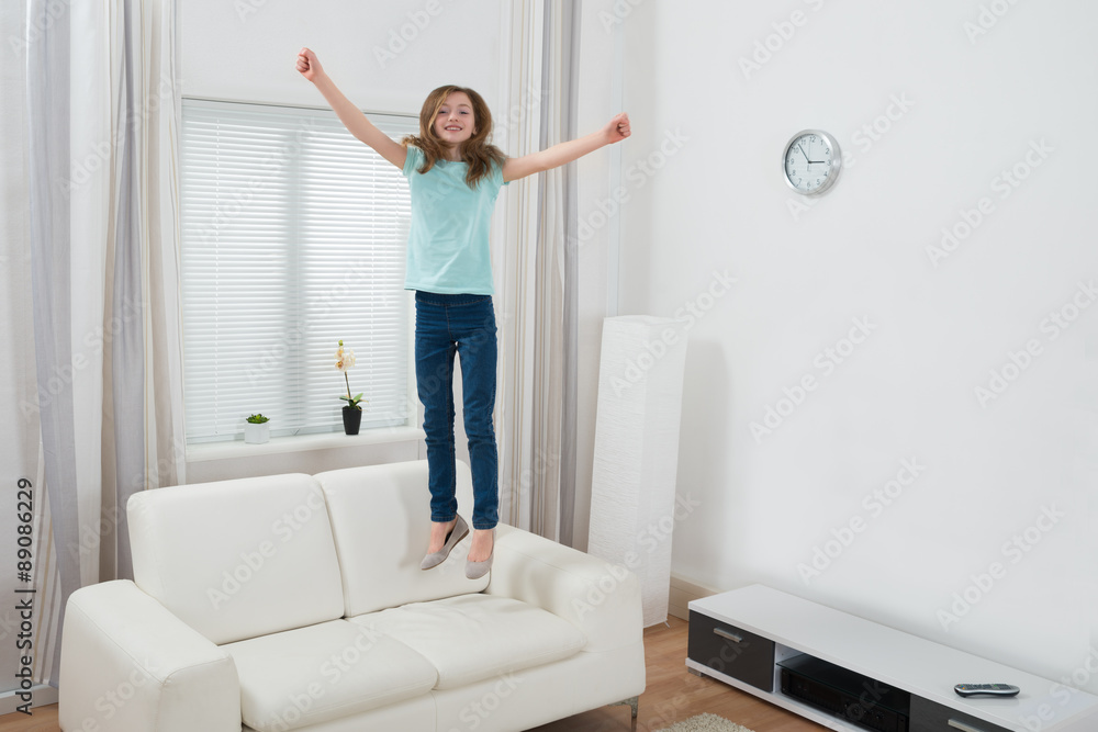 Girl Jumping On Sofa Girl Jumping On Sofa
