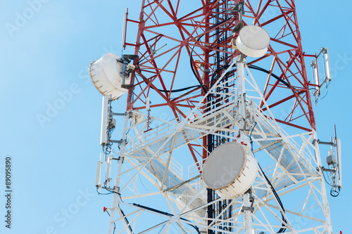 Satellite dish telecom tower on blue sky background
