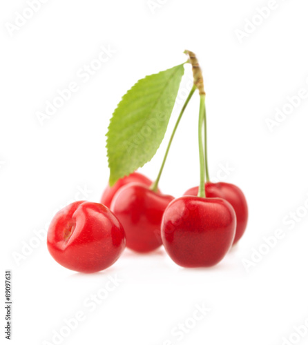  Ripe cherries with a leaf.