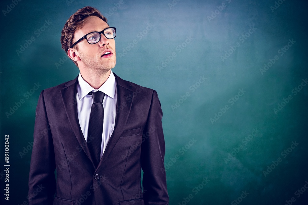 Composite image of young businessman thinking and looking up Composite image of young businessman thinking and looking up