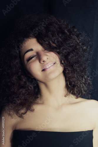 Portrait of a beautiful young woman laughing