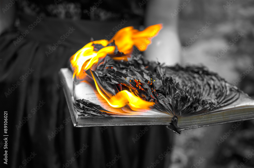 Abstract background - the burning book in women's hands