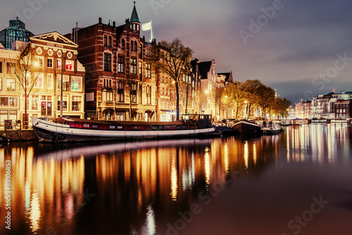 Beautiful night in Amsterdam. Night illumination of buildings an