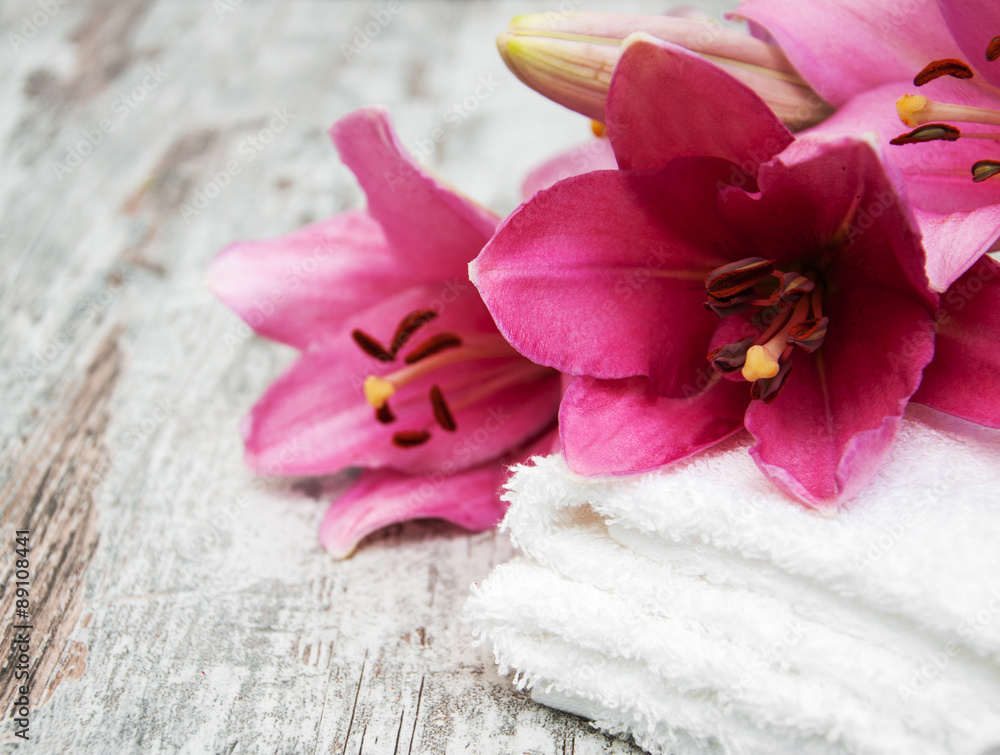 Pink lily and towels Pink lily and towels