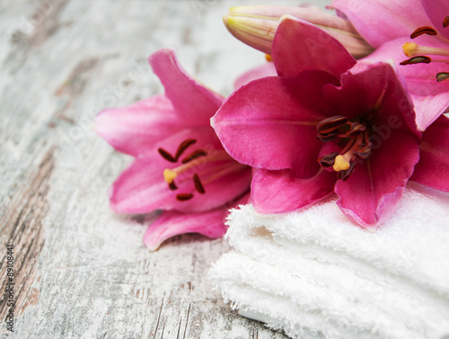Pink lily and towels