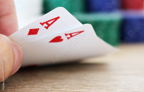 Poker hand with two aces and chips