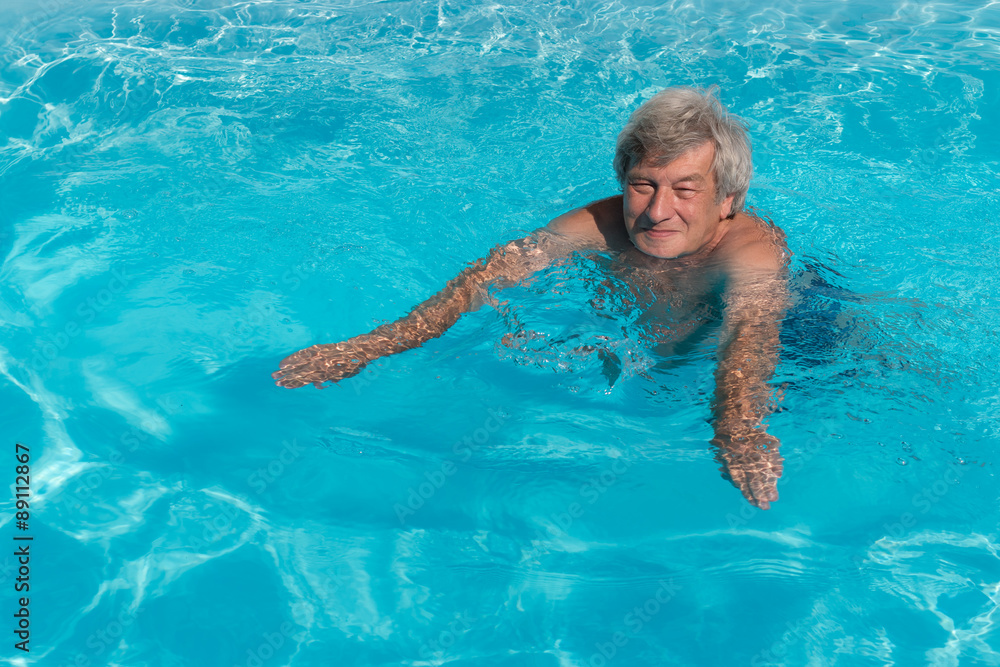 Active senior man swimming