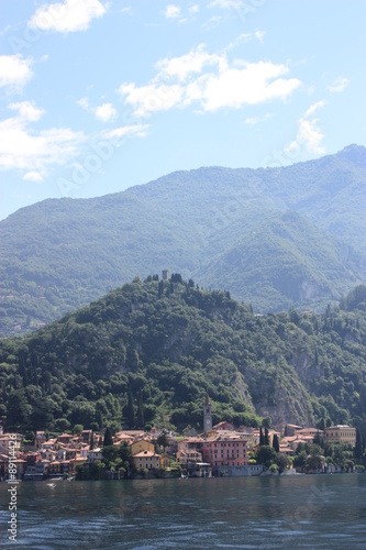 Lake Como view towards Menaggio under blue sky in Lombardy Italy 