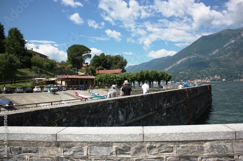 Bellagio lakefront on the shores of Lake Como under blue sky in Lombardy Italy  photo