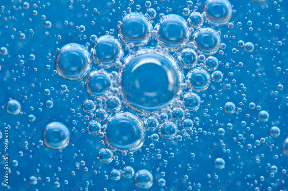 Macro Oxygen bubbles in blue clear water