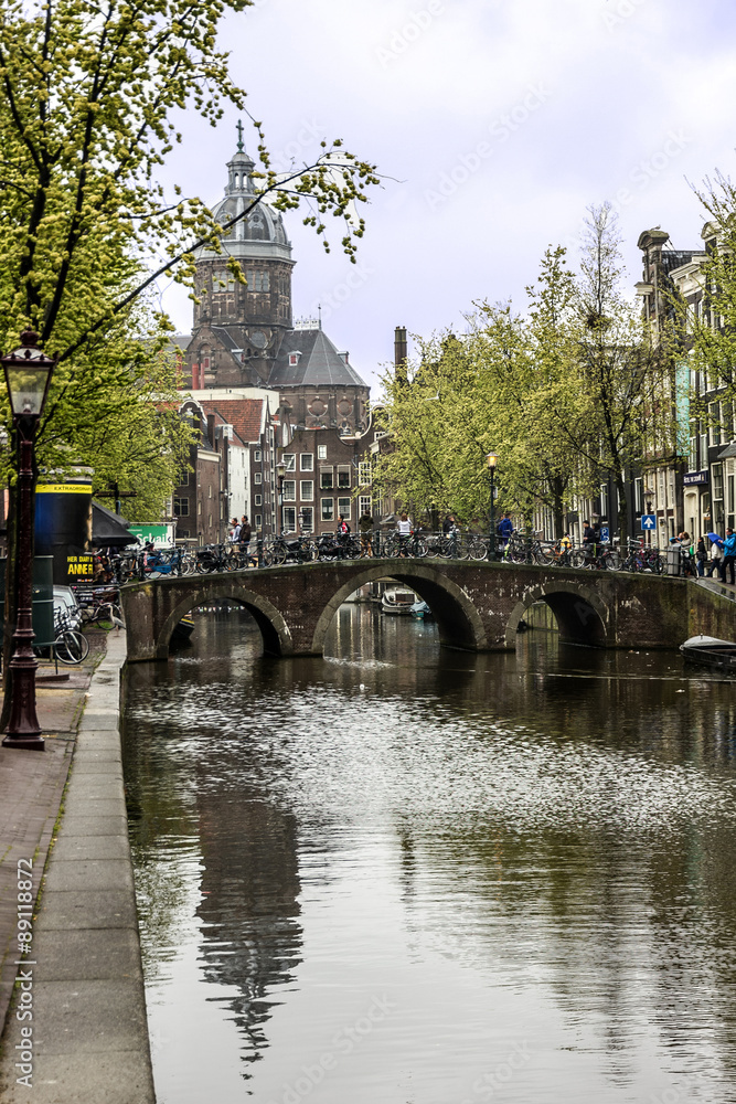 Canal and Cathedral church, Amsterdam, Netherlands