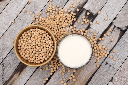 top view of soy beans and soy milk with wood background