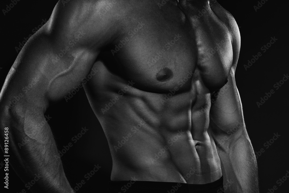 Bodybuilder showing his back and biceps muscles, personal fitnes Bodybuilder showing his back and biceps muscles, personal fitnes