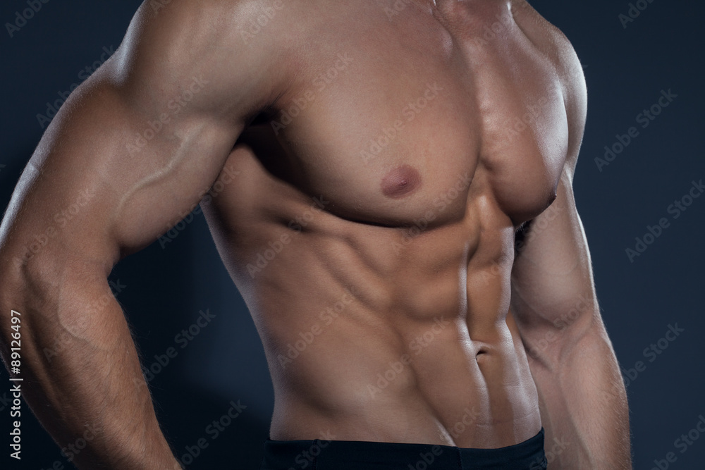 Bodybuilder showing his back and biceps muscles, personal fitnes Bodybuilder showing his back and biceps muscles, personal fitnes