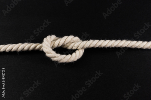 Knot Tied in a Length of White Rope