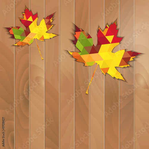 Autumnal Maple Leaf triangle on a wooden background