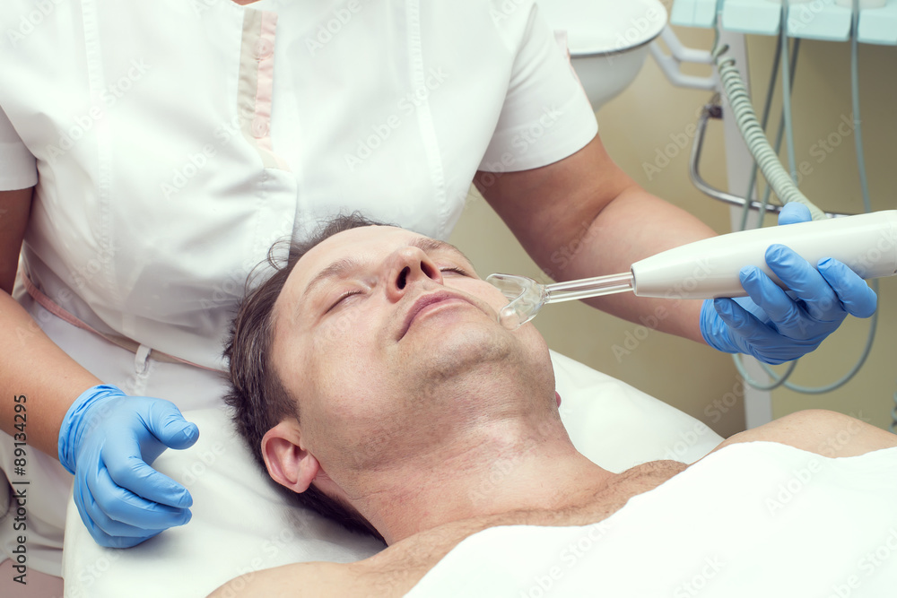 man in a beauty salon facial and massage man in a beauty salon facial and massage