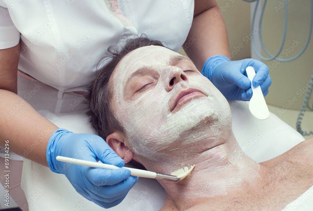 man in a beauty salon facial and massage man in a beauty salon facial and massage