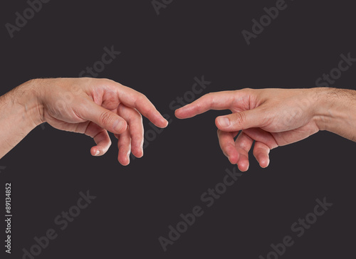 Two hands about to touch photo