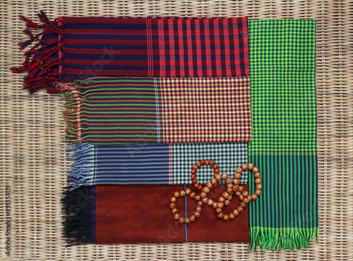 Colorful traditional khmer scarfs and beads photo