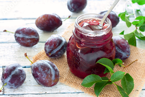 Jar of plum jam photo