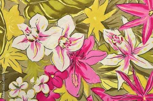 Fototapeta Naklejka Na Ścianę i Meble -  Colorful tropical floral pattern on fabric. Pink and white flowers with green leaves print as background.
