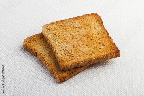 Two pieces of toast on the table