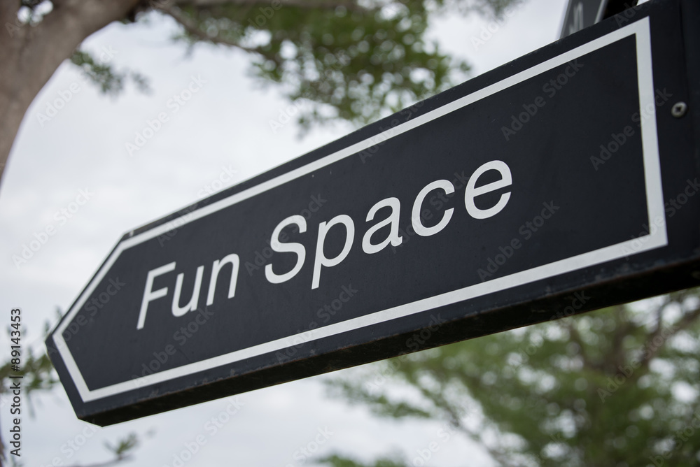 Fun space creative sign with tree as the background Fun space creative sign with tree as the background