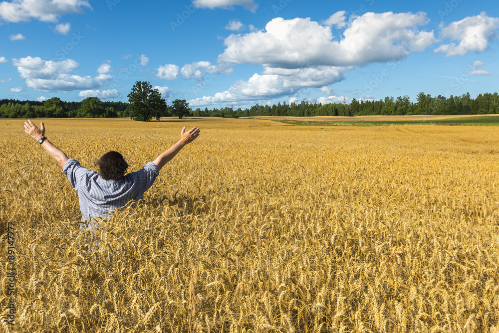 Man among field with ripening wheat Man among field with ripening wheat