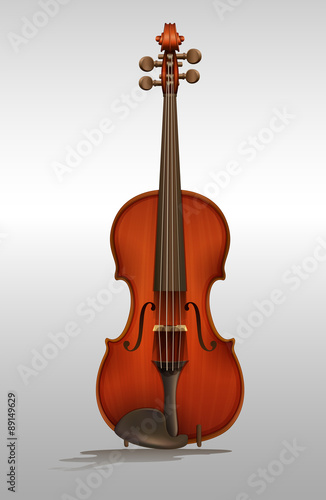 Wooden violin on gray