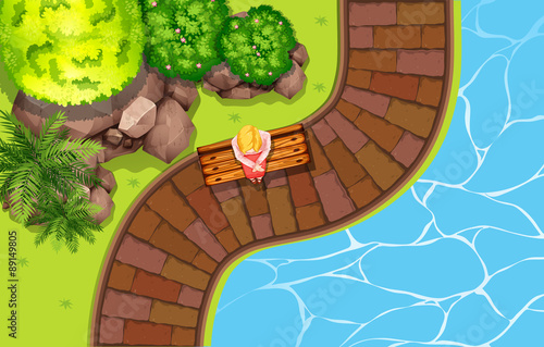 Girl sitting by the pool