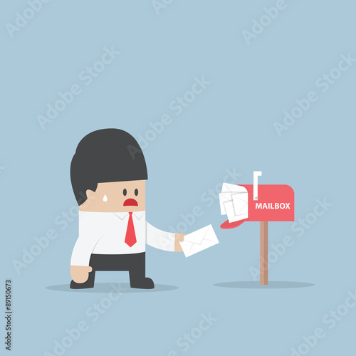 Businessman got a lot of mail in mailbox
