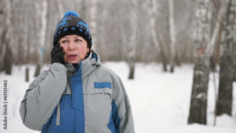 A portrait of an an adult woman talking by the phone
A portrait of an an adult woman talking by the phone