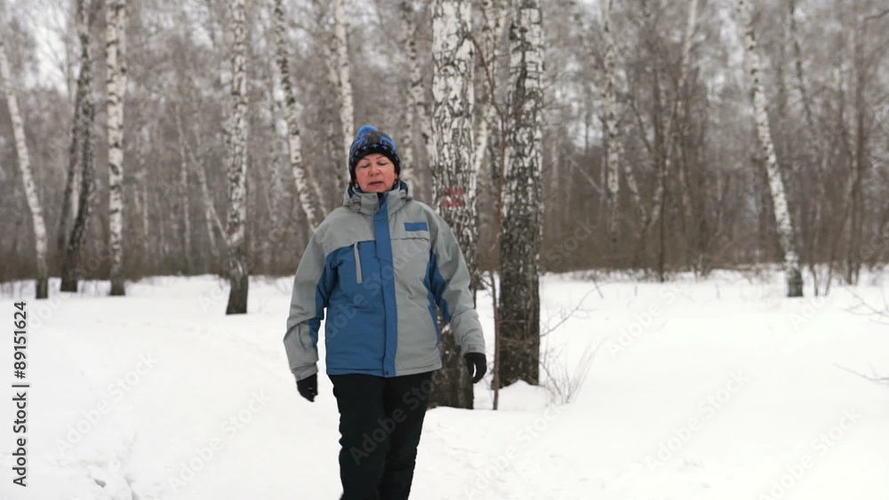 An adult woman is walking through the forest
An adult woman is walking through the forest