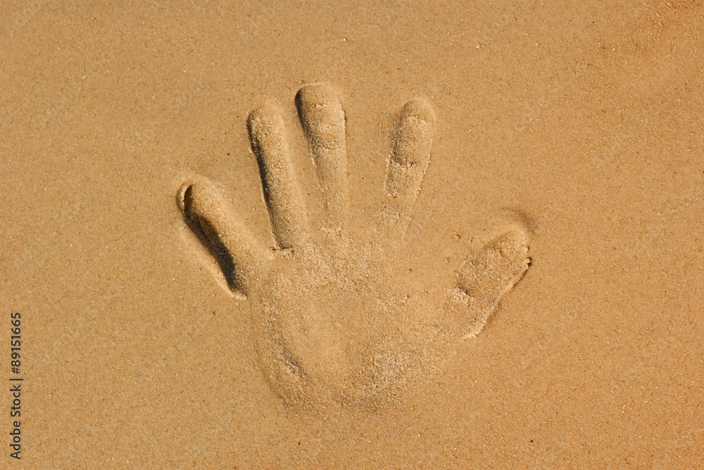 hands palm imprint on the beach hands palm imprint on the beach