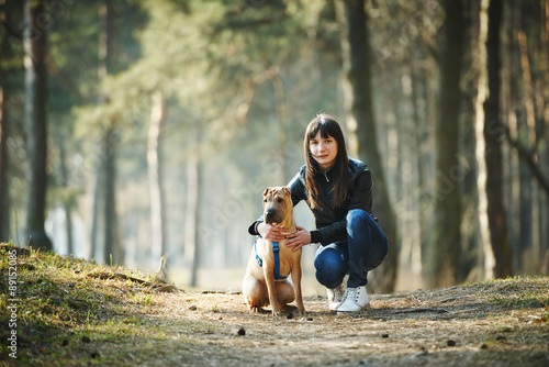 girl with dog in the park
