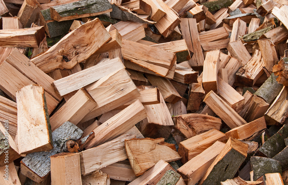 Chopped firewood logs as an abstract background Chopped firewood logs as an abstract background