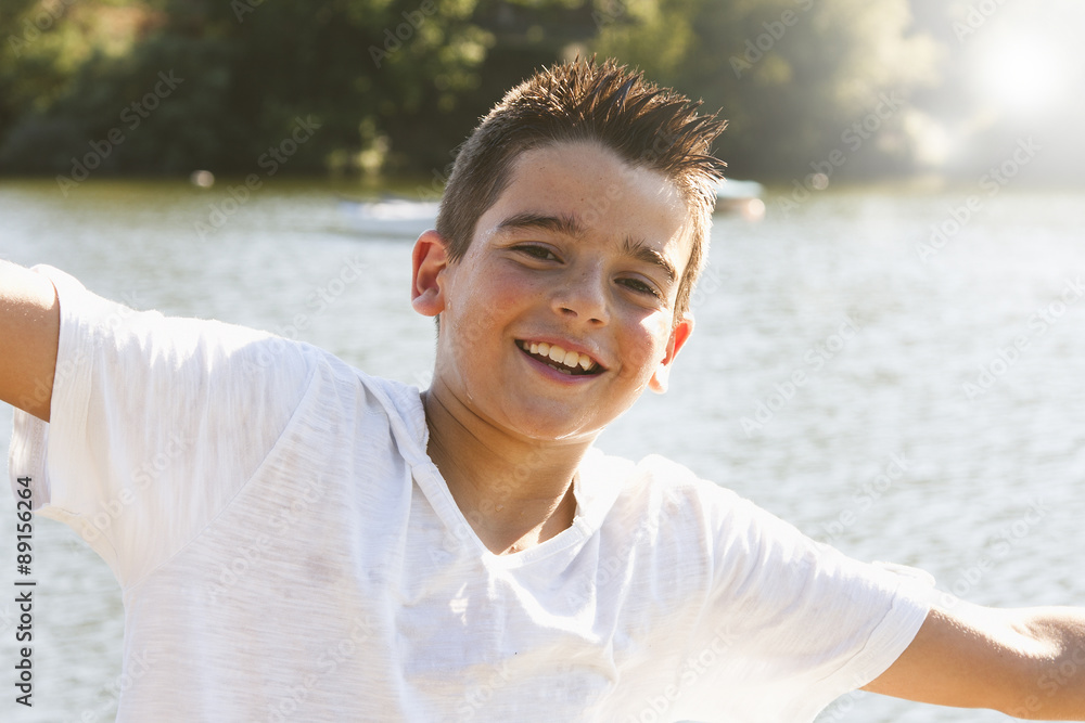 portrait of boy outdoors smiling