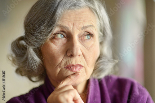 Portrait of thinking elderly woman