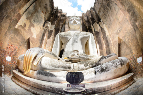 SUKHOTHAI THAILAND: The Main Buddha with golden hand in the temple of Sukhothai historical park in Sukhothai, Thailand