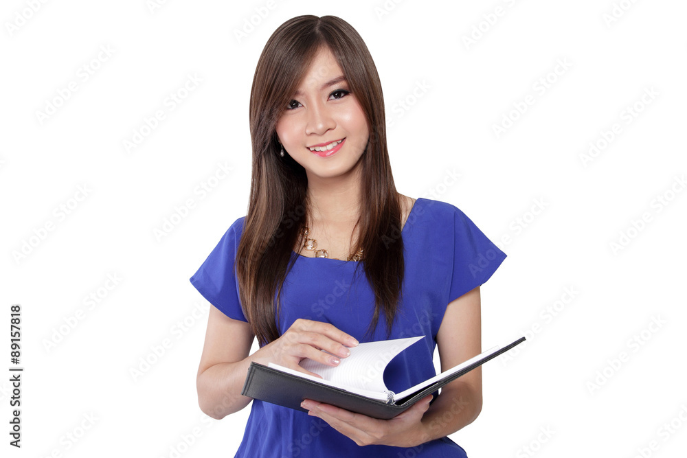 Young Asian woman open book page and smile Young Asian woman open book page and smile