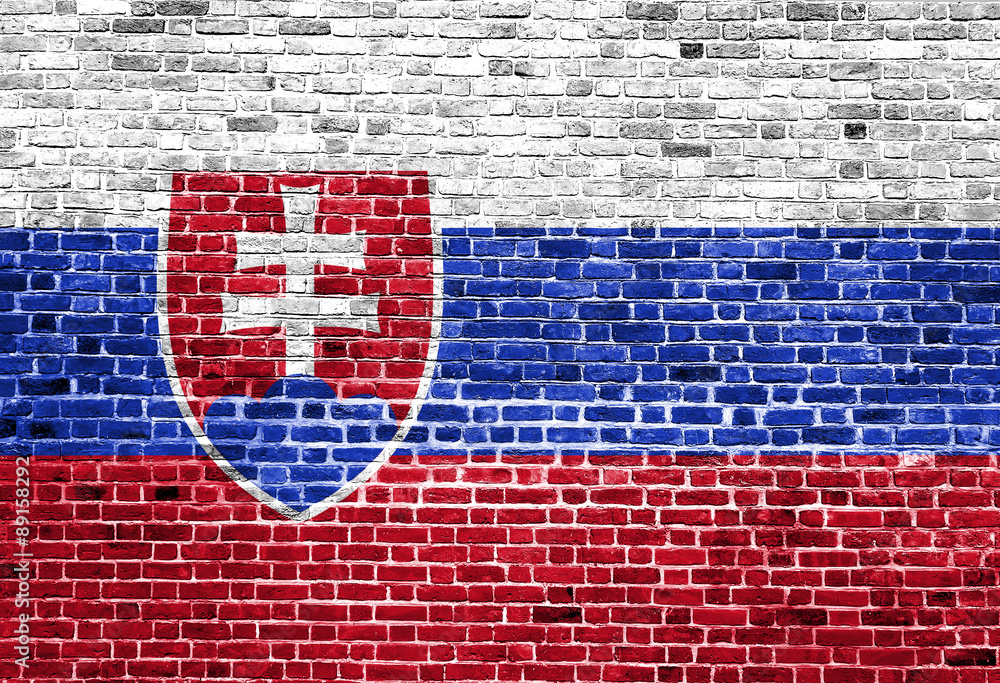 Flag of Slovakia painted on brick wall, background texture Flag of Slovakia painted on brick wall, background texture