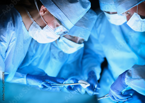 Young surgery team in the operating room photo