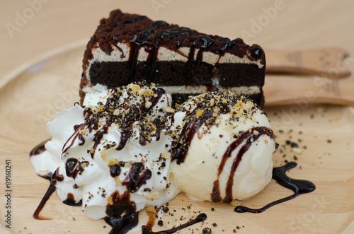 Fudge cake with vanilla ice cream photo