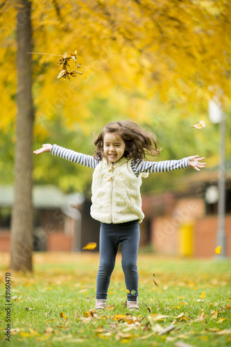 Little girl at the autumn park