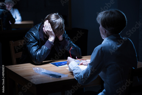 Young offender covering ears